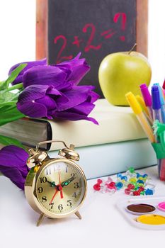 Clock, flowers and apple, back to school concept isolated