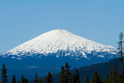 Mount Bachelor in Oregon is photographed from a distance to create this nature scenic landscape of the snow-capped mountain.