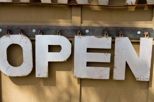 This metal sign is unique and interesting and reads open for customers of this trendy restaurant in Bend, OR.