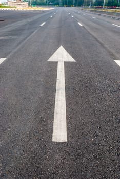 White Arrow Signs on a Road.