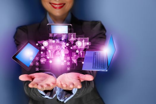 Close up image of businesswoman with 3d images of devices in her hands