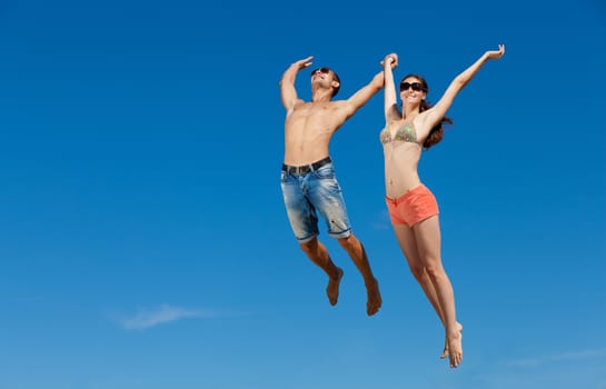 Portrait of a happy young couple enjoying at beach