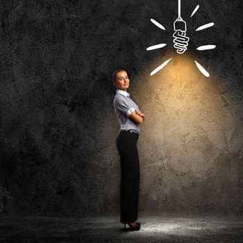 Image of attractive businesswoman against dark background