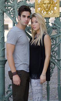 Attractive couple next to one other looking in camera, standing