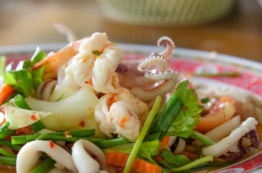  close up spicy mix salad with seafood   and  fresh vegetable