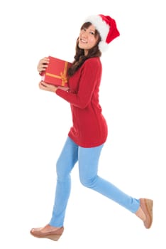 Beautiful Christmas woman running and holding gift wearing Santa hat. Standing in full body isolated on white background. Smiling woman portrait of a beautiful Asian model.