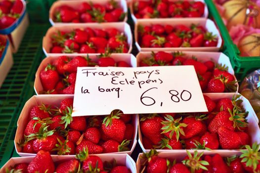 Baskets of fresh strawberries at street market