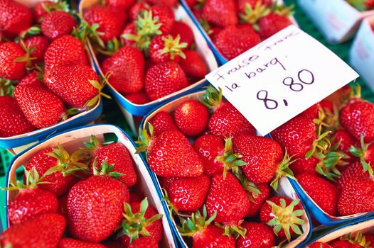 Baskets of fresh strawberries at street market