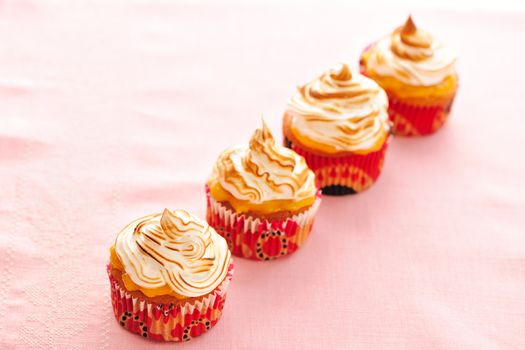 Cupcakes with whipped cream and icing