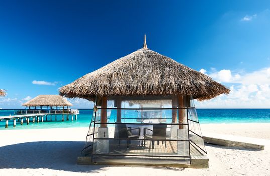 Beautiful beach with bungalow jetty at Maldives