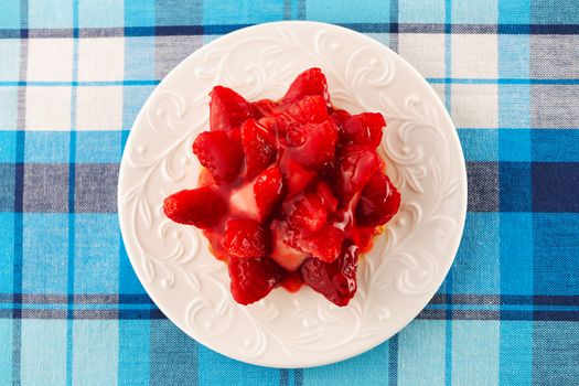 Homemade strawberry tart on table