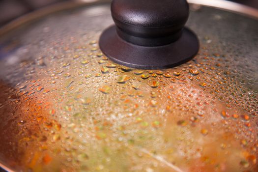 Close-up shot of a pan with glass lid  