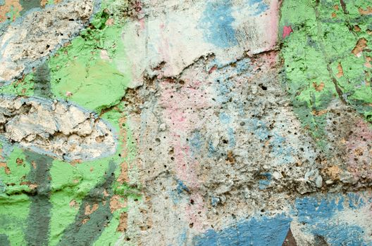 background of grunge old masonry wall painted various colors. rough surface backdrop.