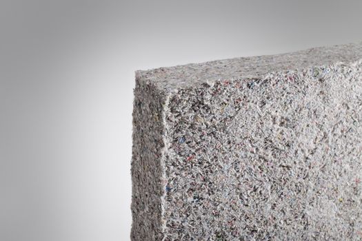 Cellulose insulation batt panel, made of recycled newspapers, used as building thermal insulation.