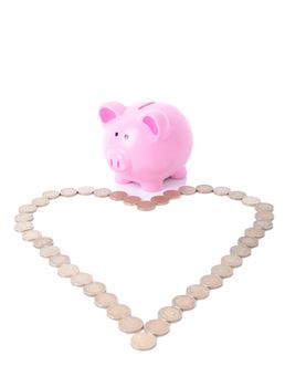 piggy bank looking at a heart shape of coins, love money