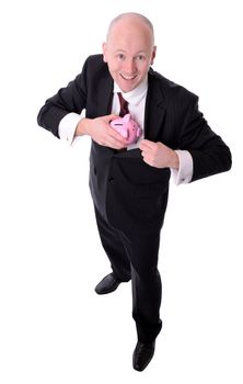 man putting away savings or getting out savings piggy bank isolated on white