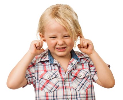 A sad boy looking distressed and blocking his ears with his fingers. Isolated on white.