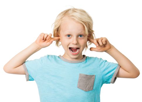 A cute cheeky young boy smiling and sticking his fingers in his ears. Isolated over white.