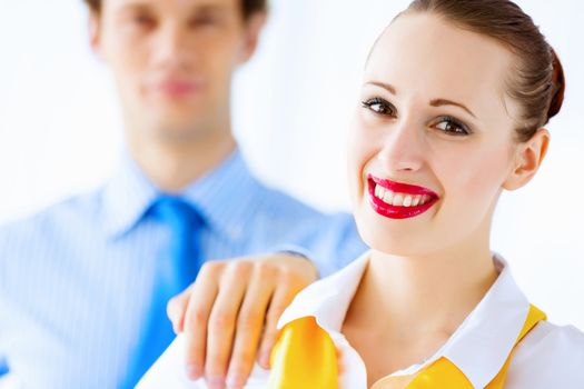 Image of businessman and businesswoman smiling joyfully