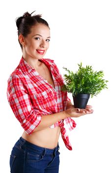 Girl holding a plant in a pot isolated on white background