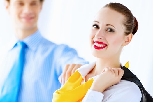 Image of businessman and businesswoman smiling joyfully