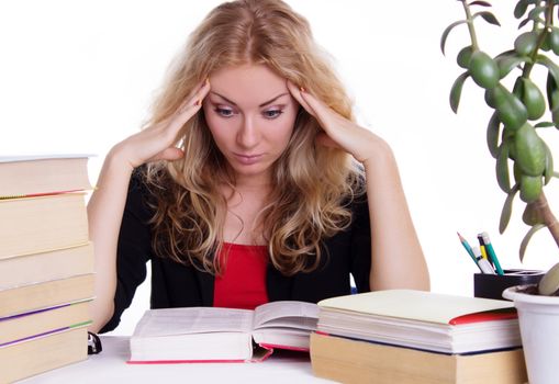 Stressed student girl with pile of books isolated on white