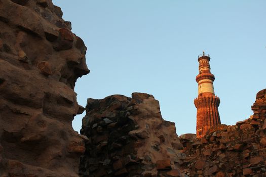 qutub minar behind walls