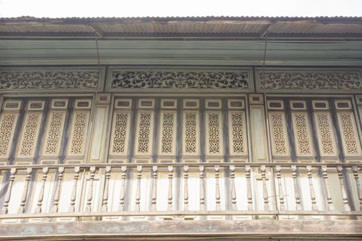 The traditional wooden balcony at 100 years old town of Luang Prabang Laos.