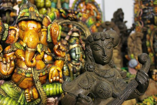 wooden god and goddess statues