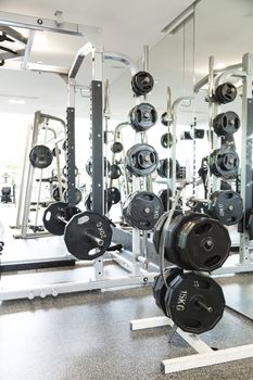 Weight lifting equipments in a club gym.