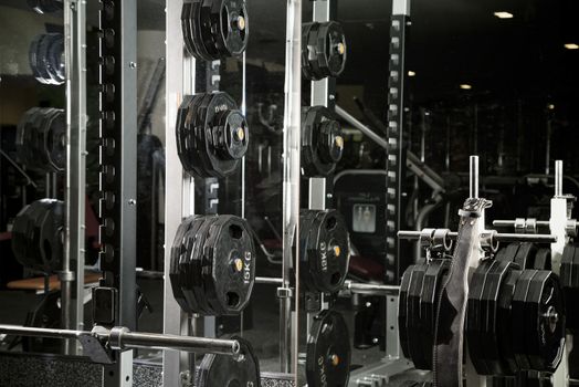 Weight lifting equipments in a club gym.