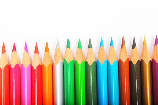colorful pencils on white background in vertical position