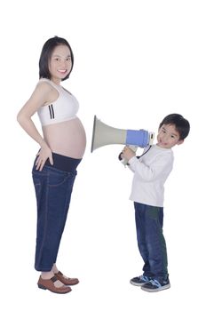 Cute boy communicate to pregnant  with megaphone