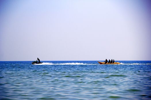 People ride on the sea on a jetski
