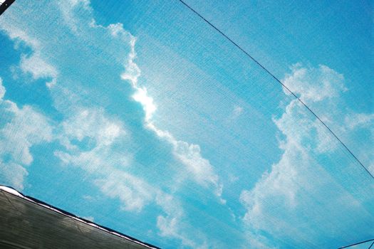 blue sky and clouds covered with mesh