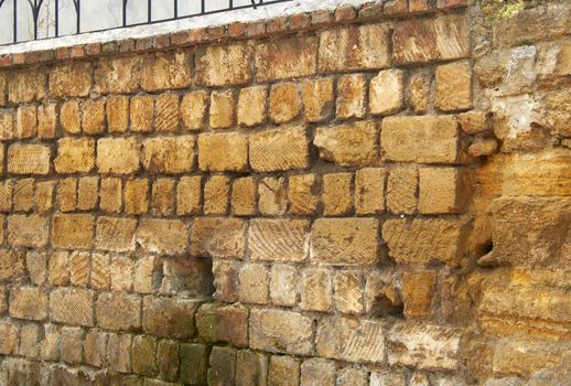 old stone fence falling apart