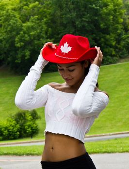 Beautiful Canadian girl with a red cowboy hat