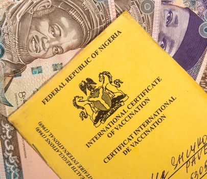 Nigerian vaccination book on nairas banknotes