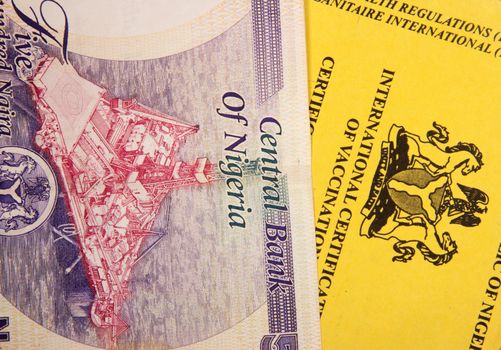 Nigerian vaccination book on nairas banknotes