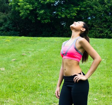 Young fit woman in the park