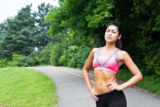 Young woman resting after running