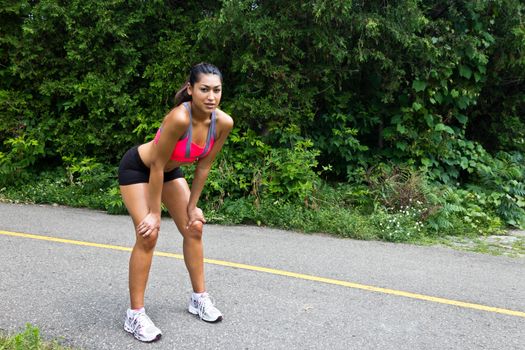 Young woman exhausted after running