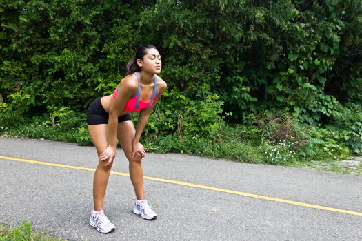 Young woman exhausted after running