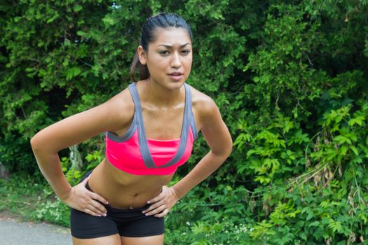 Young woman exhausted after running