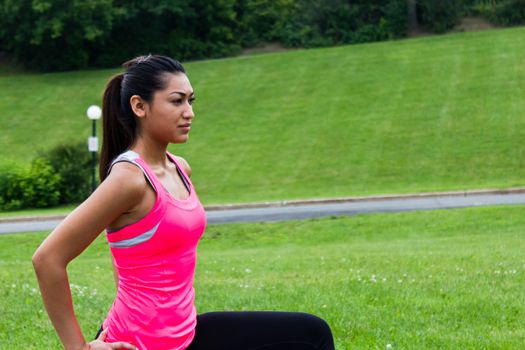 Young woman stretching before a run