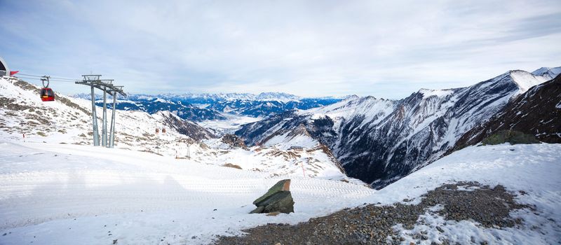 Cable car going to Kitzsteinhorn peak, panoramic view over Kaprun and Zell am See, Austria 