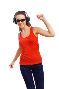 Happy smiling girl dancing and listening to music