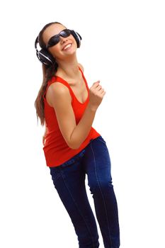 Happy smiling girl dancing and listening to music