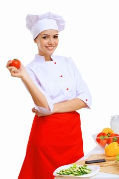 Young cook preparing food from fresh vegetables