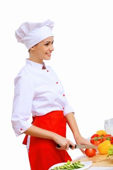 Young cook preparing food wearing red apron